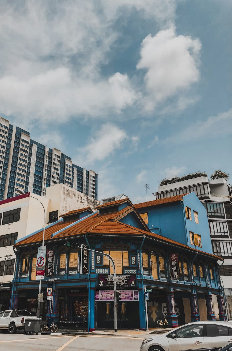 Singapore shophouse streetscape under a bright sky